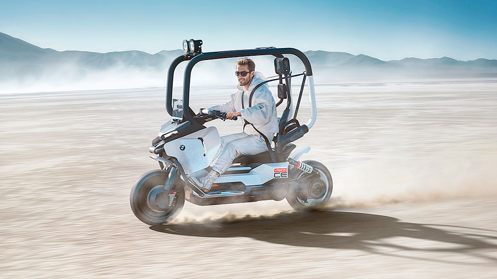 BMW, Vision CE, IAA Mobility 2025, Movilidad urbana eléctrica, scooter eléctrico BMW, moto sin casco, BMW C1 2025, BMW Motorrad, IAA Mobility 2025, jaula de seguridad moto, autoequilibrio scooter, movilidad urbana eléctrica, scooter premium Alemania