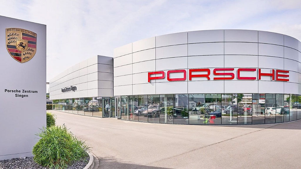 Porsche, Grupo Volkswagen, industria automotriz, estrategia electrificación Porsche, Grupo Volkswagen pérdidas operativas, automóviles eléctricos transición Porsche, aranceles EE.UU. industria automotriz Alemania, Porsche Macan eléctrico ventas, industria automotriz alemana crisis, Porsche volvía al motor de combustión, VW reestructuración empleo Alemania